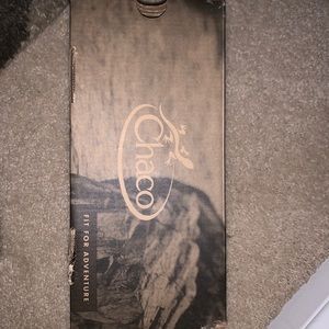 Black and white chacos, multiple strap